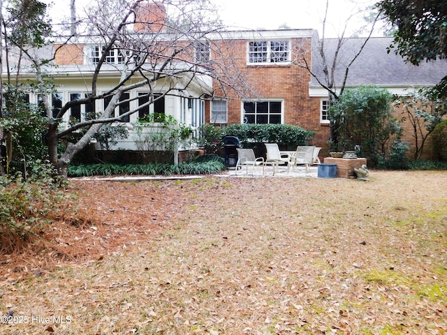 back of property featuring a patio