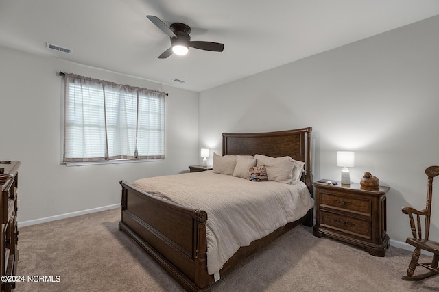 bedroom featuring ceiling fan and light colored carpet