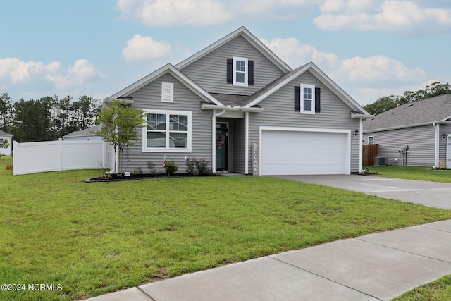 view of front facade with a garage and a front lawn