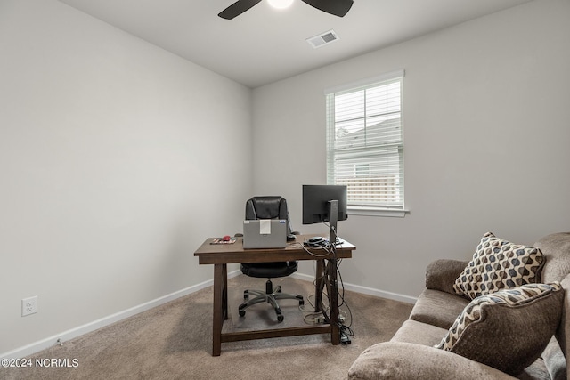 office space with carpet and ceiling fan