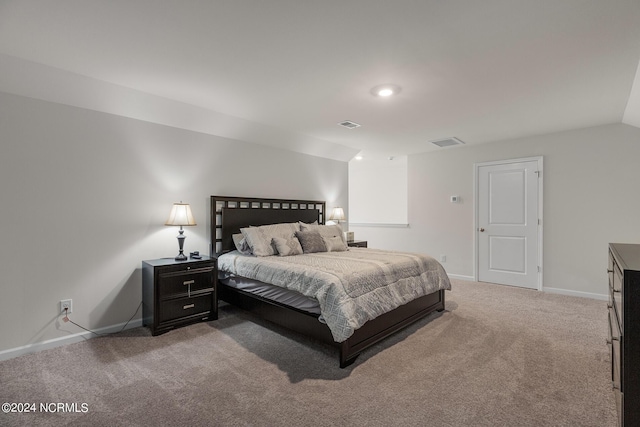 carpeted bedroom featuring lofted ceiling