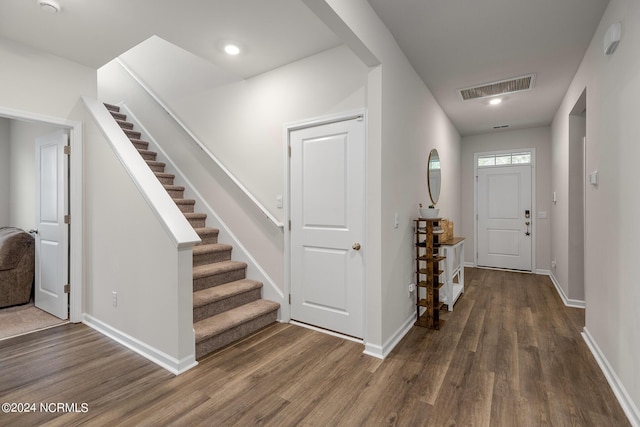 foyer entrance featuring dark wood-type flooring