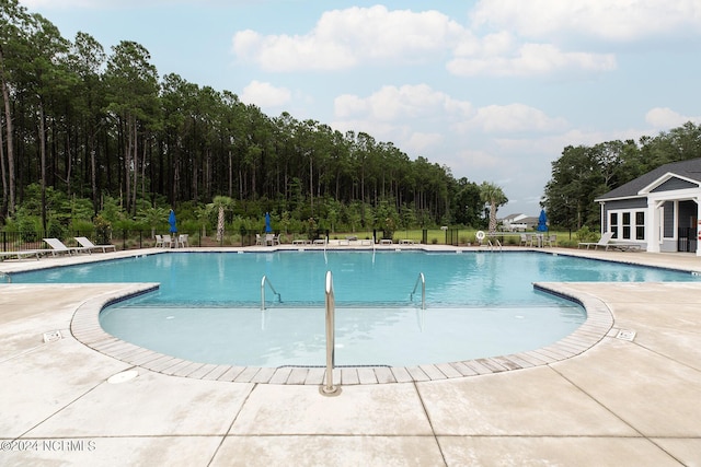 view of swimming pool featuring a patio