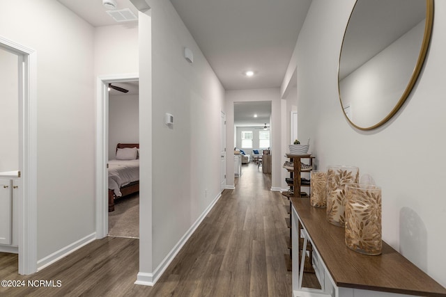 hallway with dark hardwood / wood-style floors