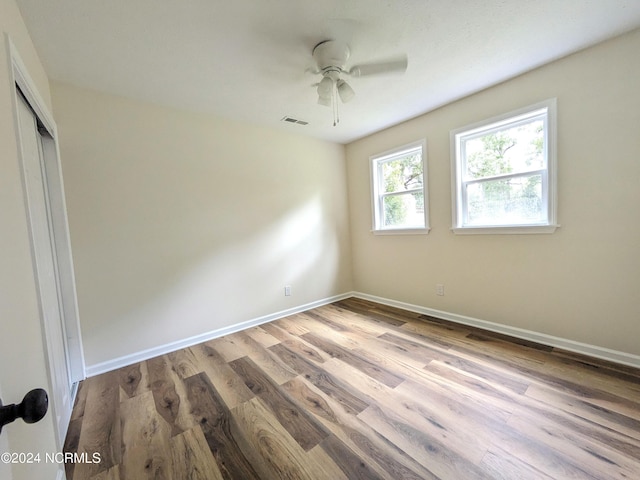 unfurnished bedroom featuring a closet, ceiling fan, and light hardwood / wood-style flooring