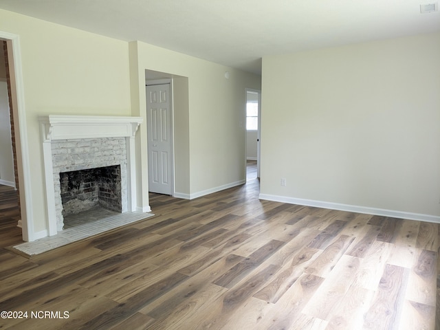 unfurnished living room featuring wood-type flooring