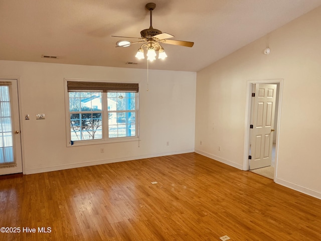 unfurnished room with lofted ceiling, ceiling fan, and hardwood / wood-style floors