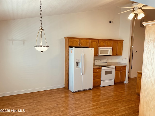 kitchen featuring white appliances, ceiling fan, high vaulted ceiling, light hardwood / wood-style flooring, and decorative light fixtures