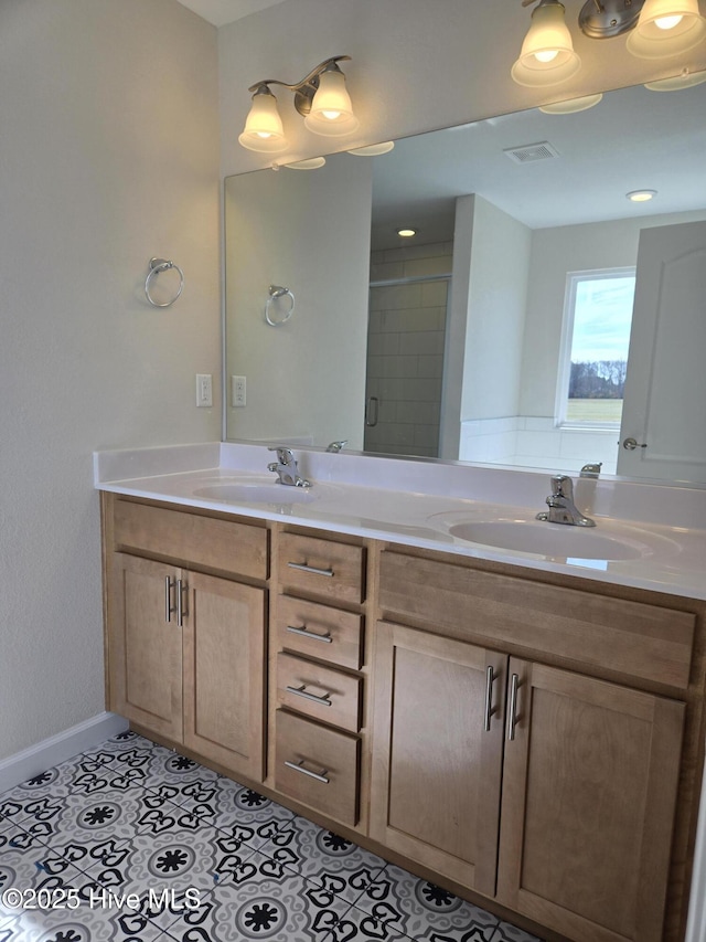 bathroom featuring tile patterned floors, vanity, and walk in shower