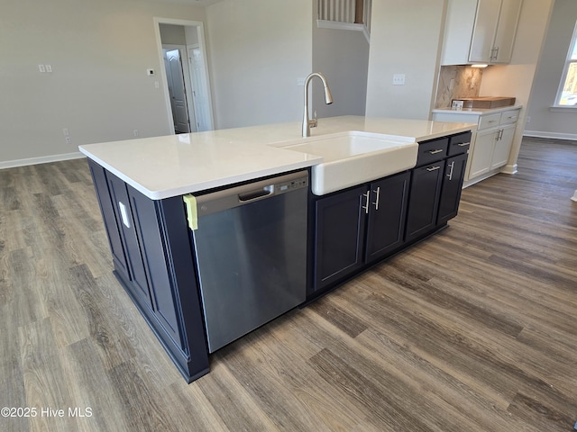 kitchen with sink, white cabinets, a kitchen island with sink, and dishwasher