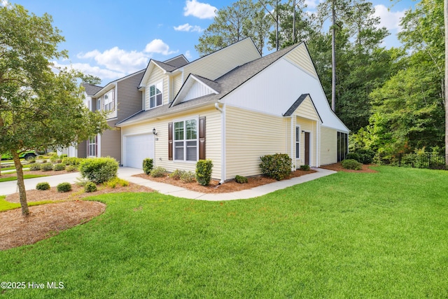 view of front of home featuring a front lawn and a garage