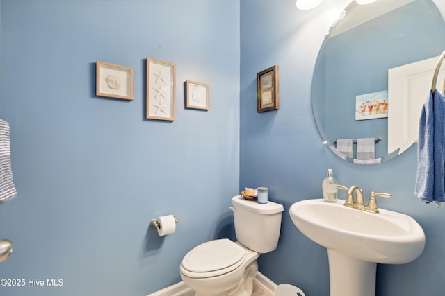 bathroom with sink and toilet