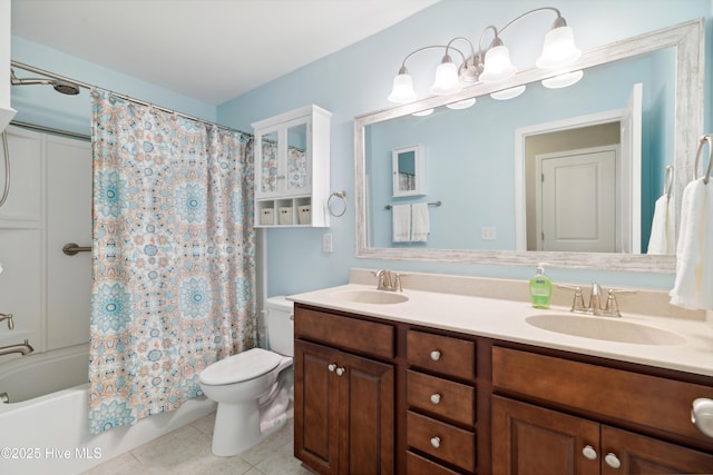 full bathroom featuring toilet, vanity, tile patterned flooring, and shower / bath combination with curtain