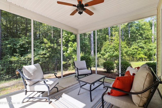 sunroom / solarium featuring ceiling fan