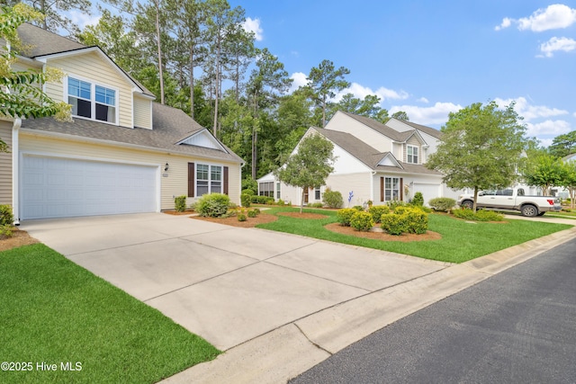 view of front facade with a garage and a front yard