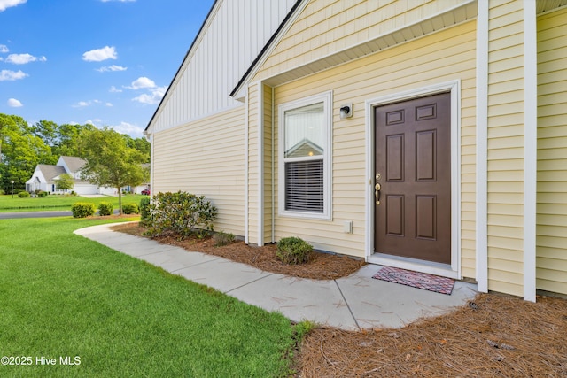 entrance to property with a yard