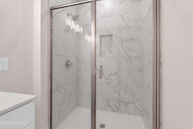 bathroom with a shower with shower door