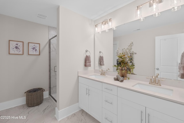 bathroom featuring vanity and a shower with shower door