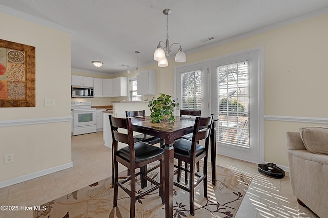 tiled dining room featuring a textured ceiling, a notable chandelier, and ornamental molding