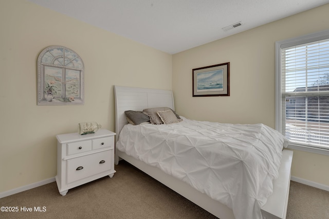 bedroom featuring light colored carpet