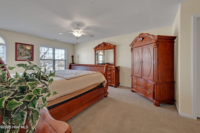 bedroom with light carpet, a textured ceiling, and ceiling fan