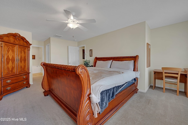 carpeted bedroom with connected bathroom and ceiling fan