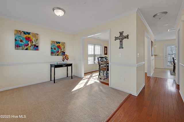 hallway featuring crown molding and hardwood / wood-style floors