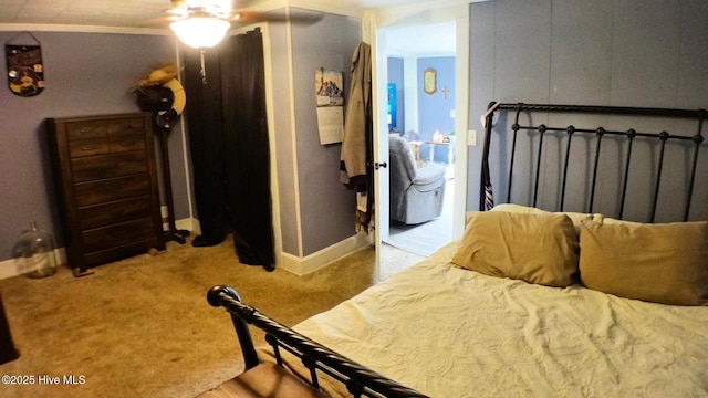 bedroom featuring connected bathroom, ceiling fan, and carpet