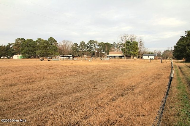 view of yard with a rural view