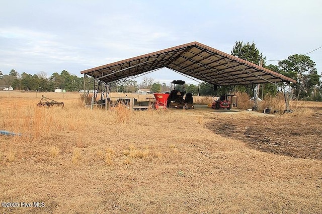 view of vehicle parking featuring a carport