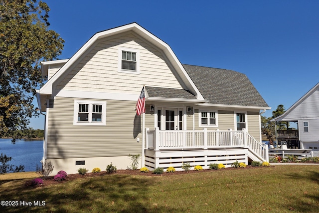 view of front of home with a front yard and a porch