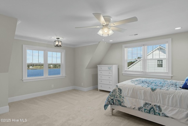 bedroom with ceiling fan with notable chandelier, light colored carpet, and crown molding