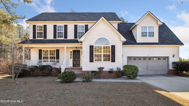 view of front of property featuring a porch and a garage