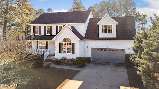 view of front of property with covered porch and a garage