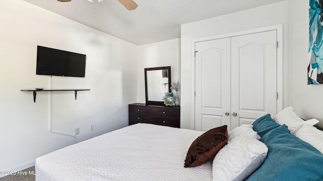 bedroom featuring ceiling fan and a closet