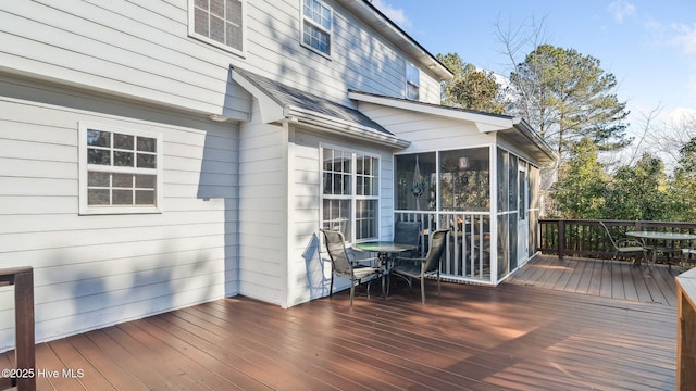 wooden terrace with a sunroom