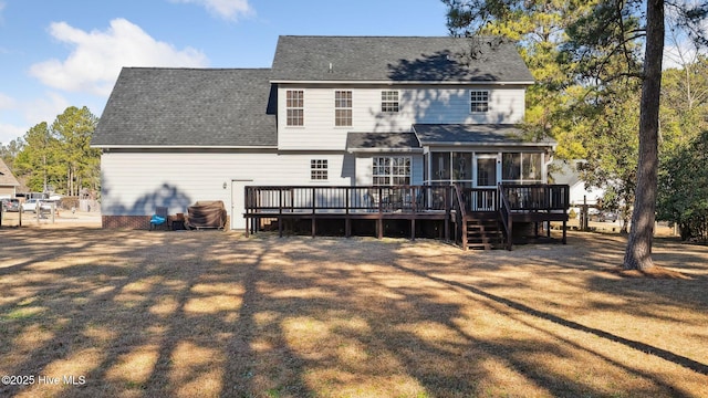 back of house with a deck and a sunroom