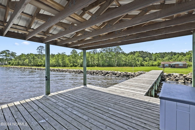 dock area featuring a water view