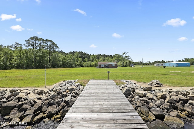 dock area featuring a lawn