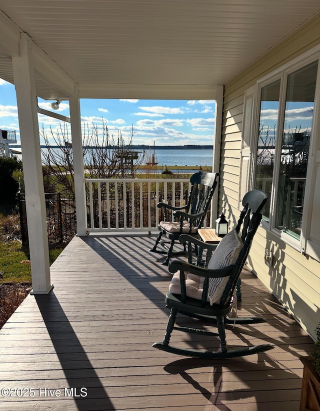 wooden terrace with a water view