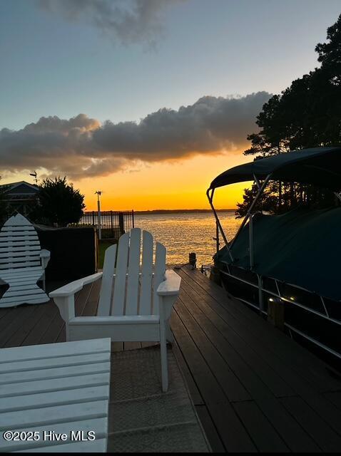 dock area with a deck with water view