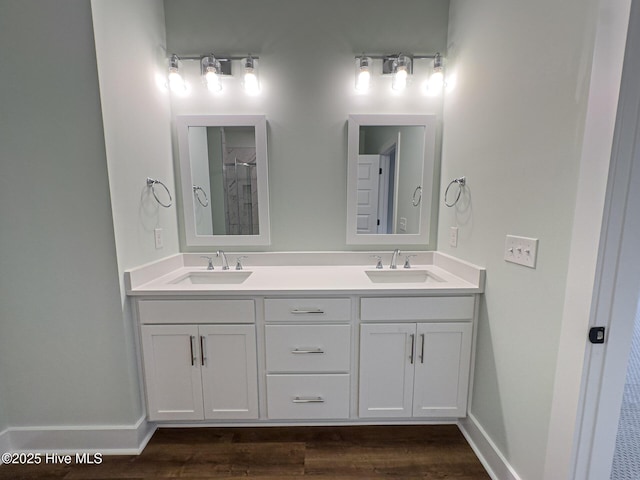 bathroom featuring hardwood / wood-style flooring and vanity