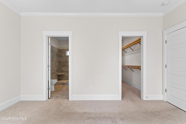 unfurnished bedroom with baseboards, ornamental molding, and carpet floors