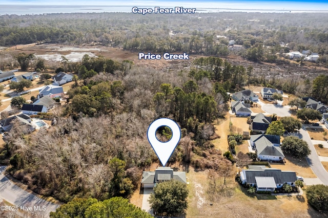 aerial view with a residential view and a view of trees