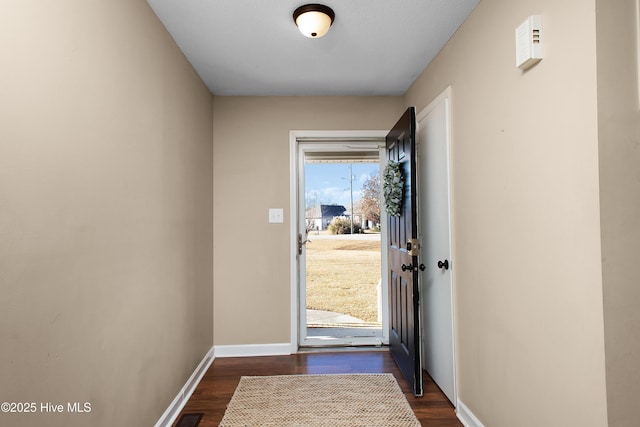 doorway to outside featuring dark hardwood / wood-style floors