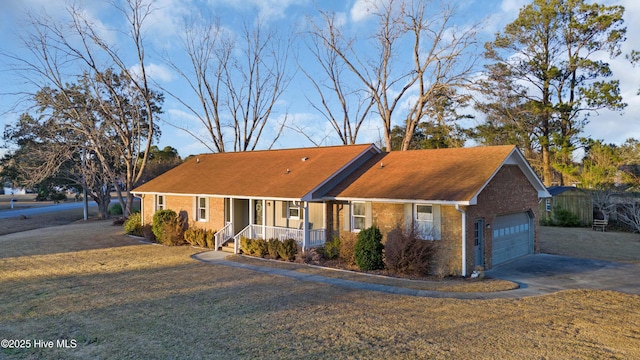 ranch-style home with a front yard and a garage