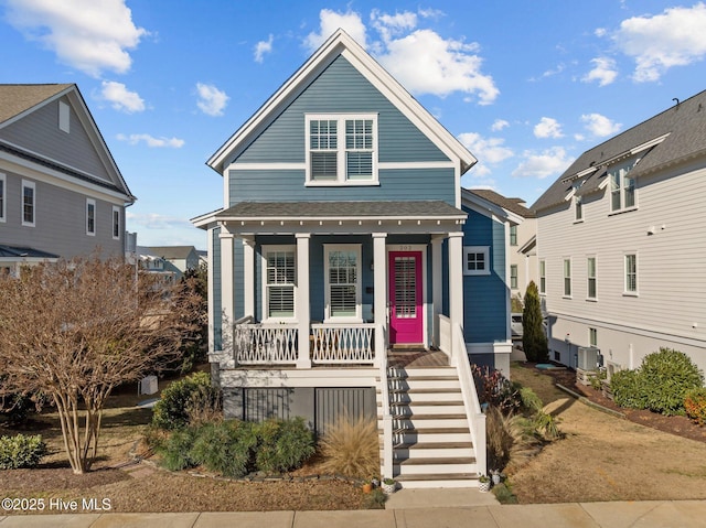 view of front of house featuring a porch and cooling unit