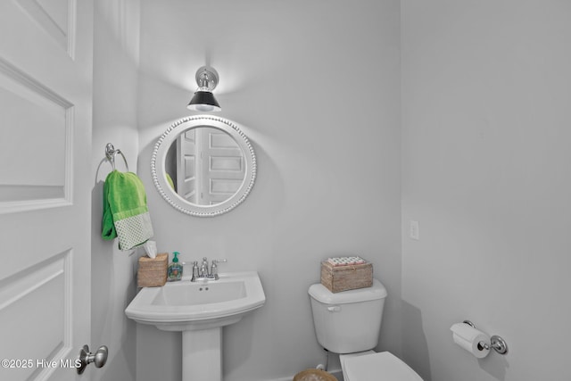 bathroom featuring toilet and sink