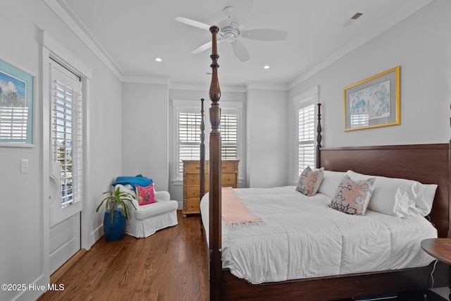 bedroom with multiple windows, ceiling fan, crown molding, and dark hardwood / wood-style flooring