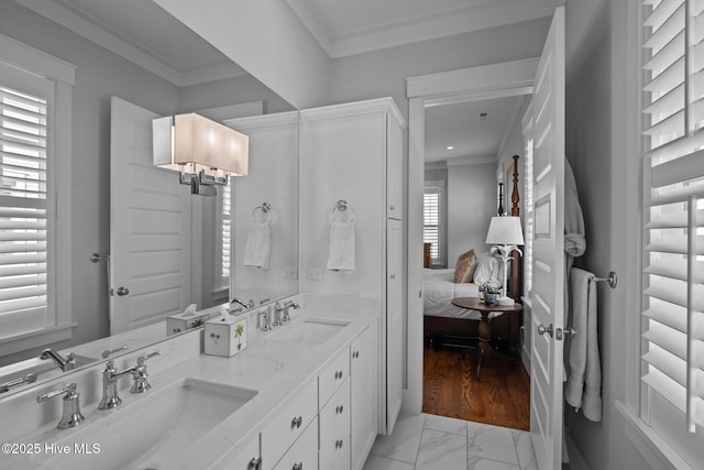 bathroom with vanity and crown molding